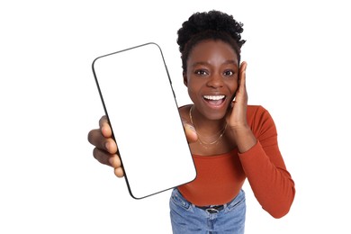 Image of Excited woman showing mobile phone with blank screen on white background. Mockup for design