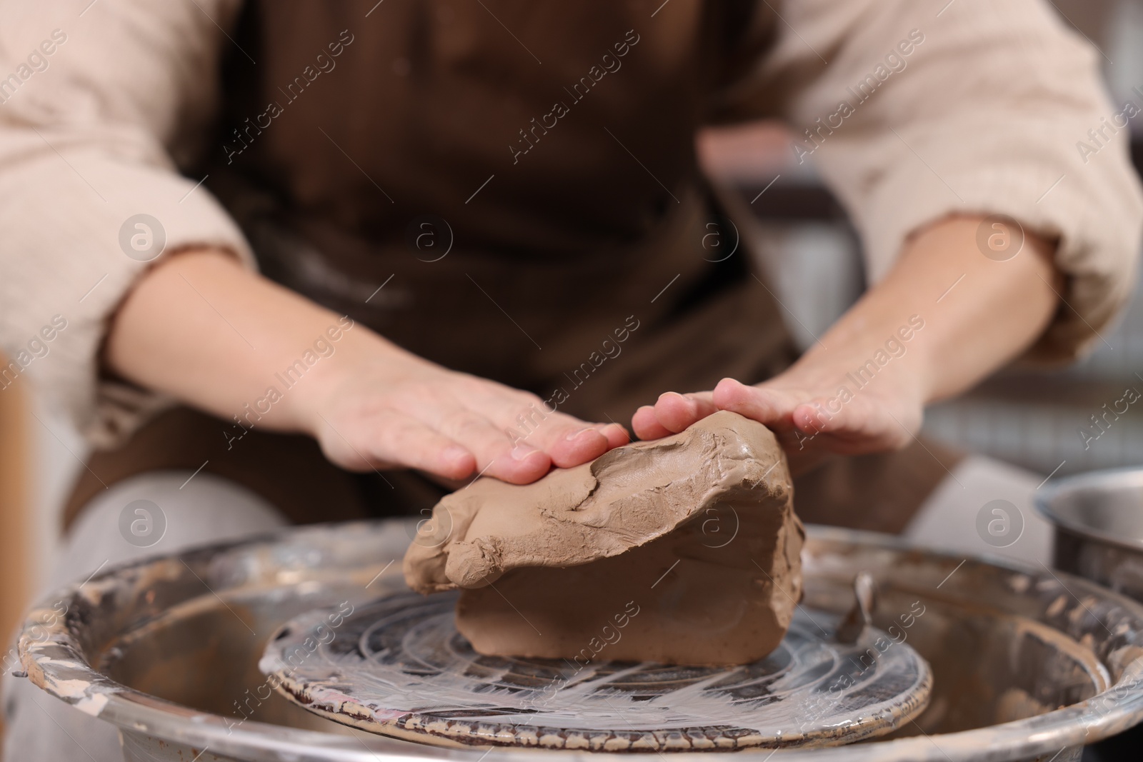 Photo of Hobby and craft. Woman making pottery indoors, closeup