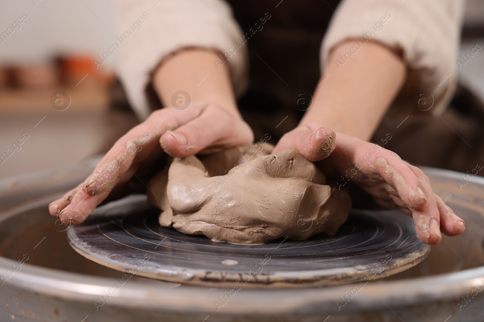 Photo of Hobby and craft. Woman making pottery indoors, closeup