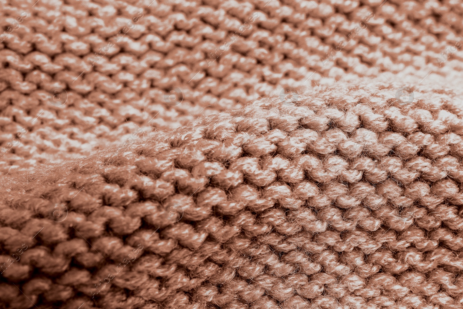 Image of Knitted fabric in mocha mousse shade, closeup. Trendy color of 2025 year