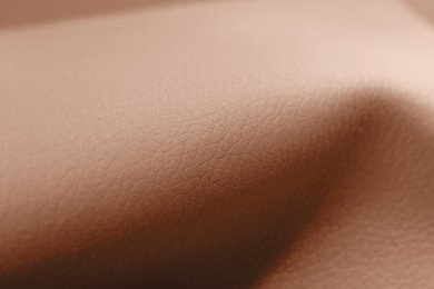 Image of Leather in mocha mousse shade, closeup. Trendy color of 2025 year