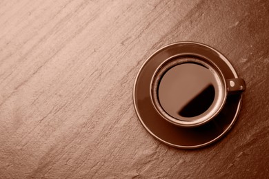 Image of Coffee on table, top view. Toned in mocha mousse shade. Trendy color of 2025 year