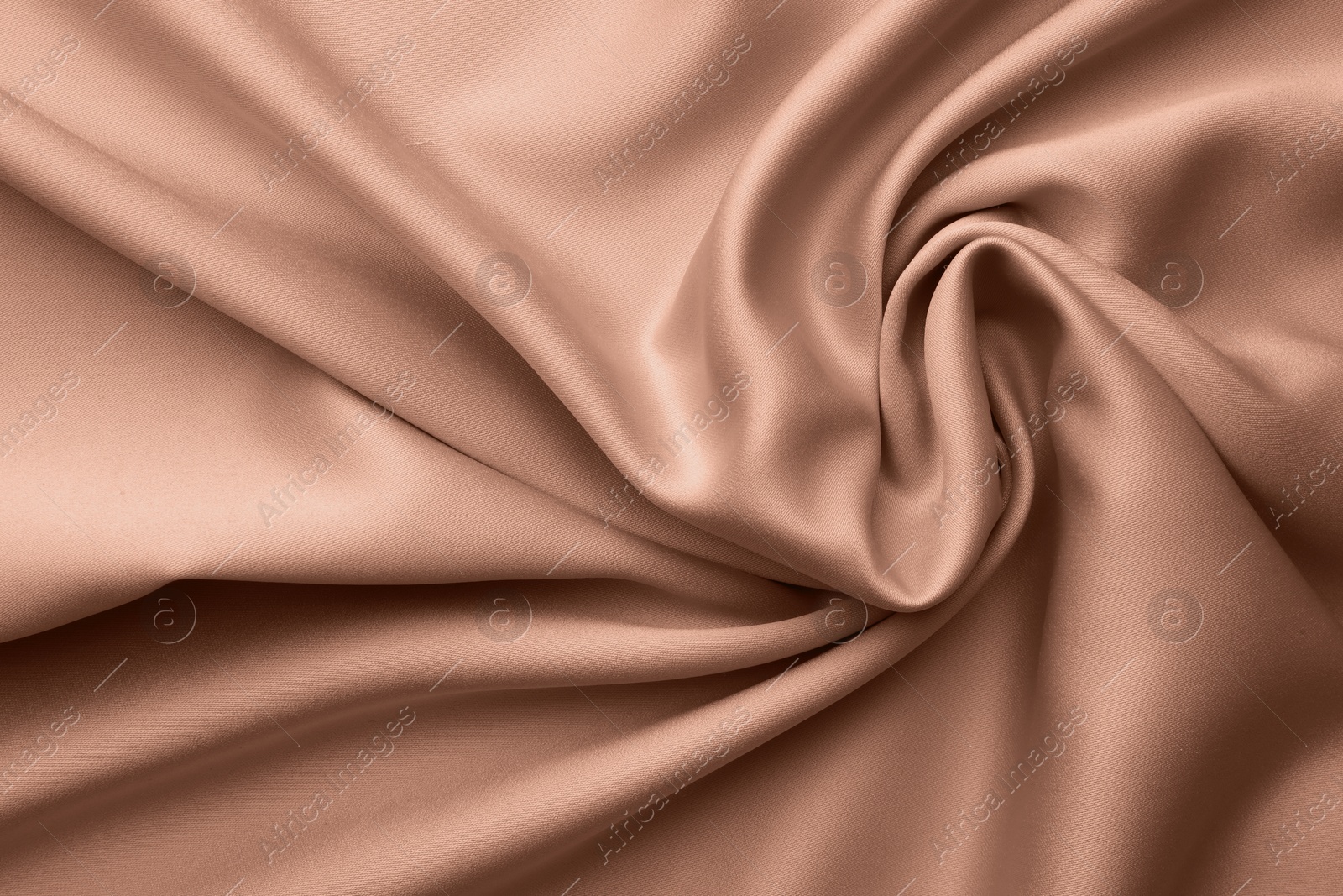 Image of Silk fabric in mocha mousse shade, closeup. Trendy color of 2025 year