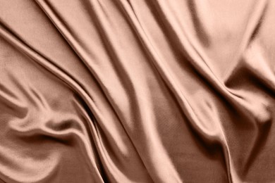 Image of Silk fabric in mocha mousse shade, closeup. Trendy color of 2025 year