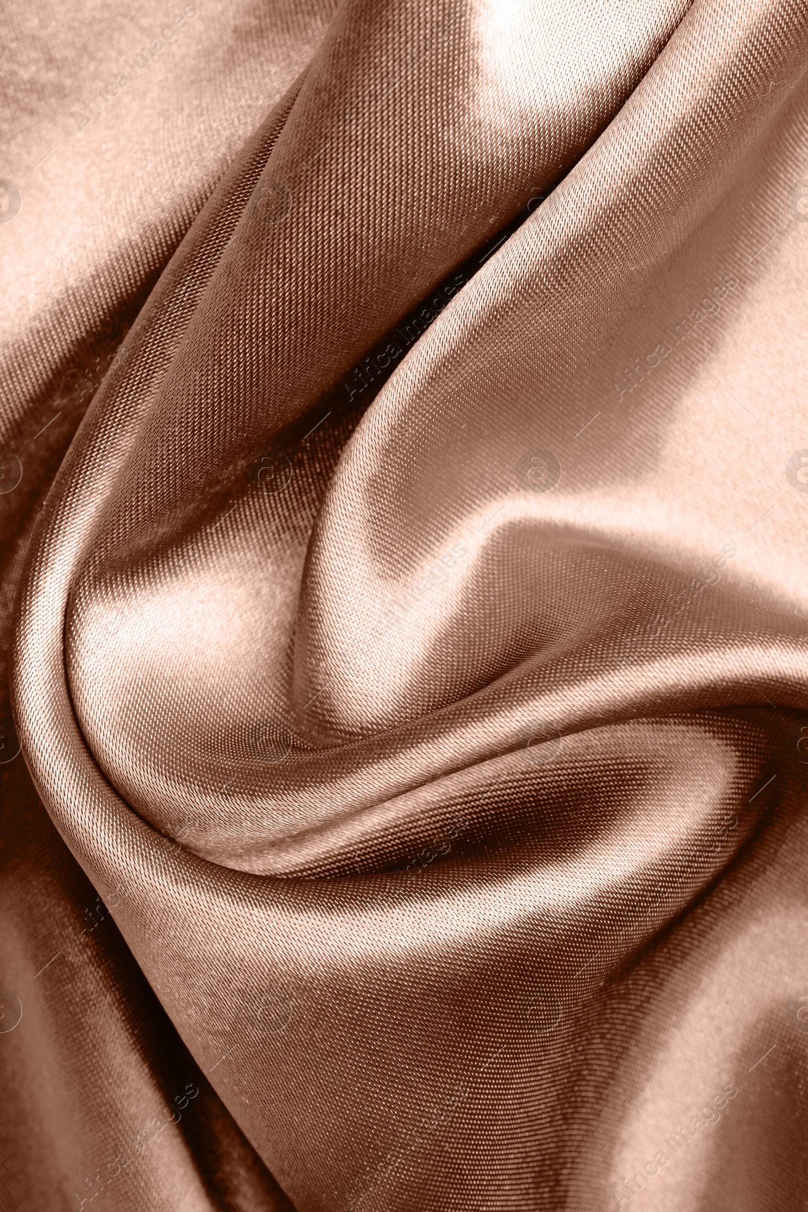 Image of Silk fabric in mocha mousse shade, closeup. Trendy color of 2025 year