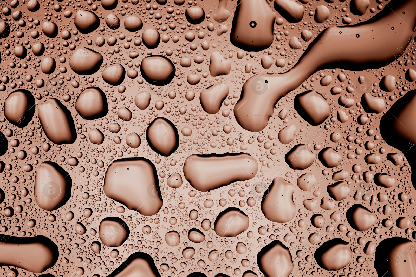 Image of Water drops on glass surface, closeup. Toned in trendy color of 2025 year - mocha mousse