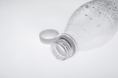 Photo of Empty plastic bottle on white background, closeup