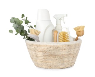 Photo of Eco-friendly cleaning products, supplies and eucalyptus branches in wicker basket isolated on white