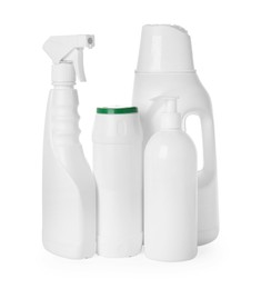 Photo of Bottles of different cleaning products isolated on white