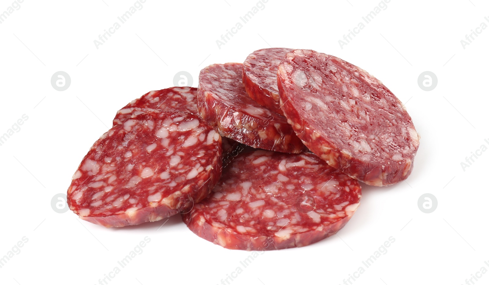 Photo of Pieces of delicious dry cured sausage isolated on white