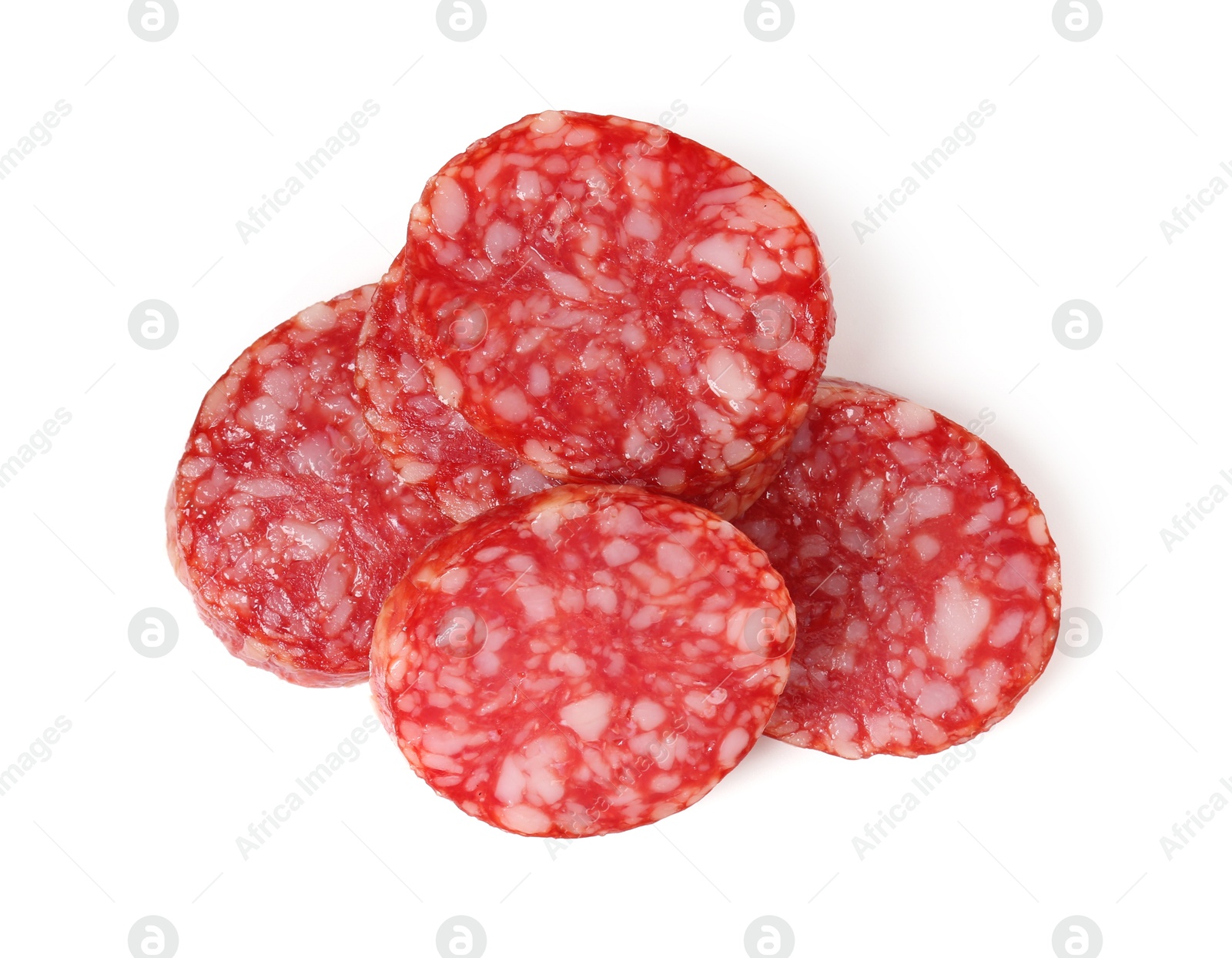 Photo of Pieces of delicious smoked sausage isolated on white, top view