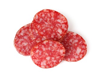 Photo of Pieces of delicious smoked sausage isolated on white, top view