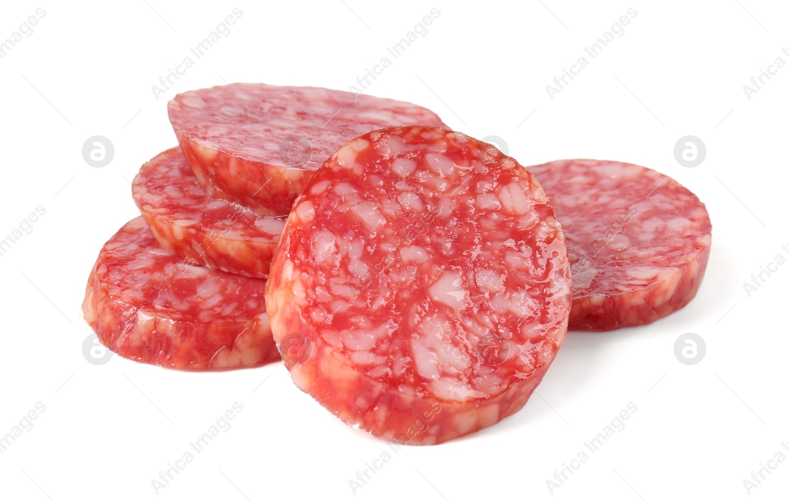 Photo of Pieces of delicious smoked sausage isolated on white