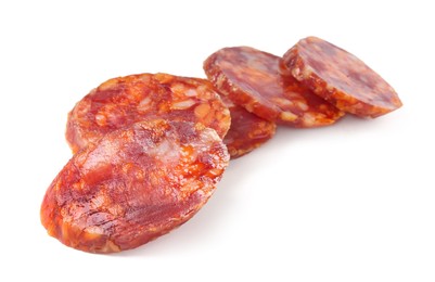 Photo of Pieces of delicious dry cured sausage isolated on white