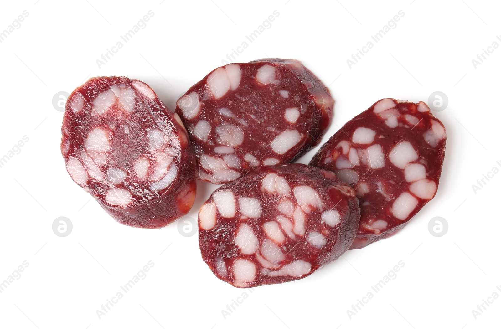 Photo of Pieces of delicious dry cured sausage isolated on white, top view