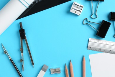 Photo of Flat lay composition with ruler and other stationery on light blue background, space for text