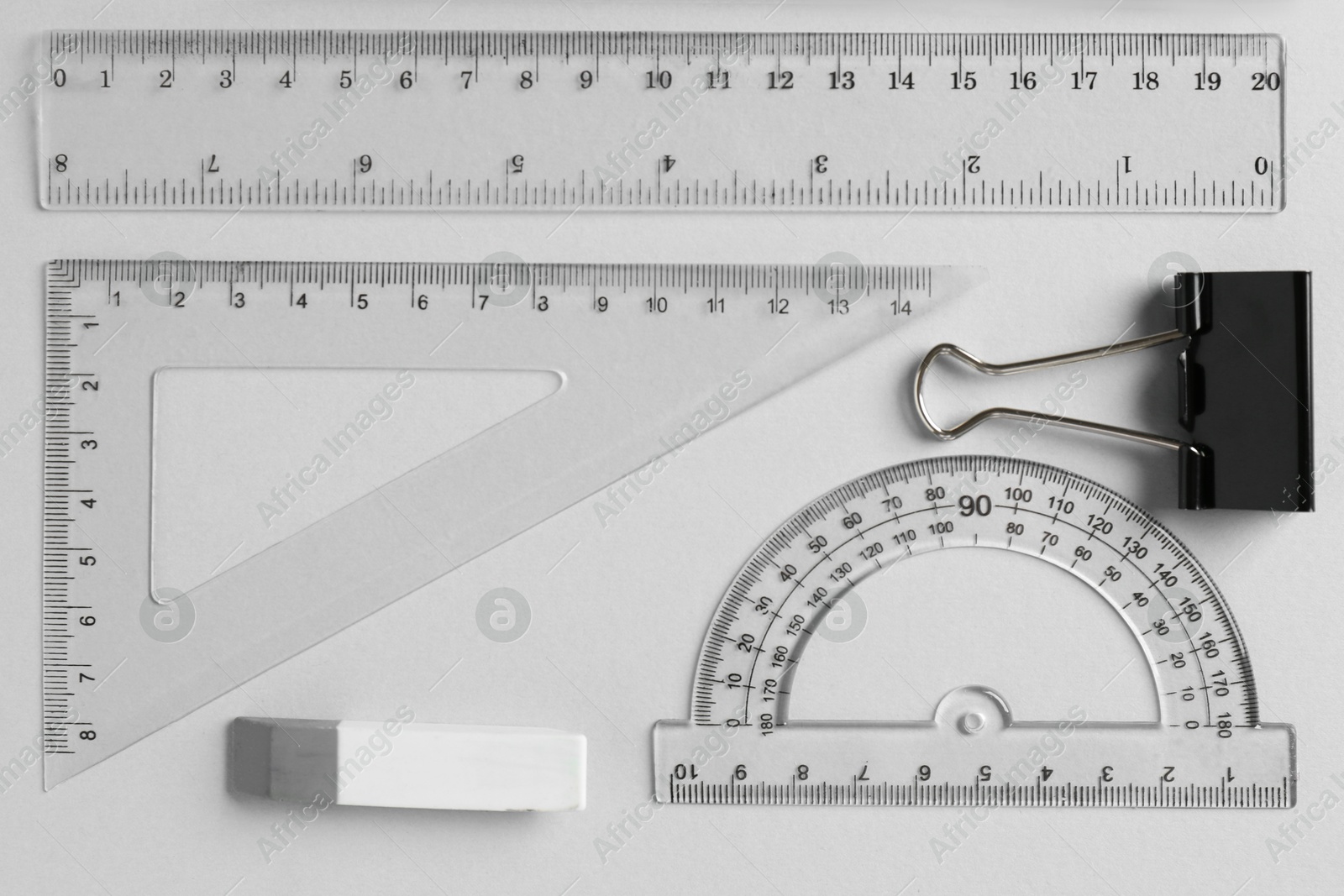 Photo of Flat lay composition with ruler and other stationery on light grey background