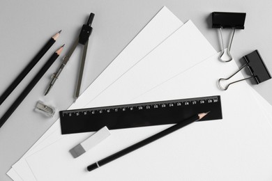 Photo of Flat lay composition with ruler and other stationery on light grey background