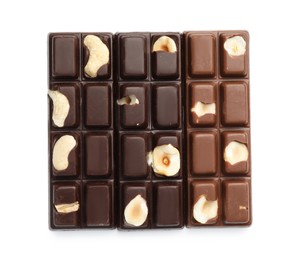 Photo of Tasty chocolate bars with nuts isolated on white, top view