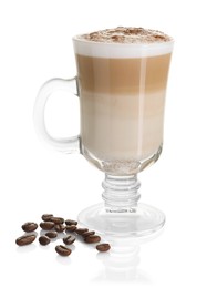 Photo of Tasty latte macchiato in glass cup and coffee beans isolated on white