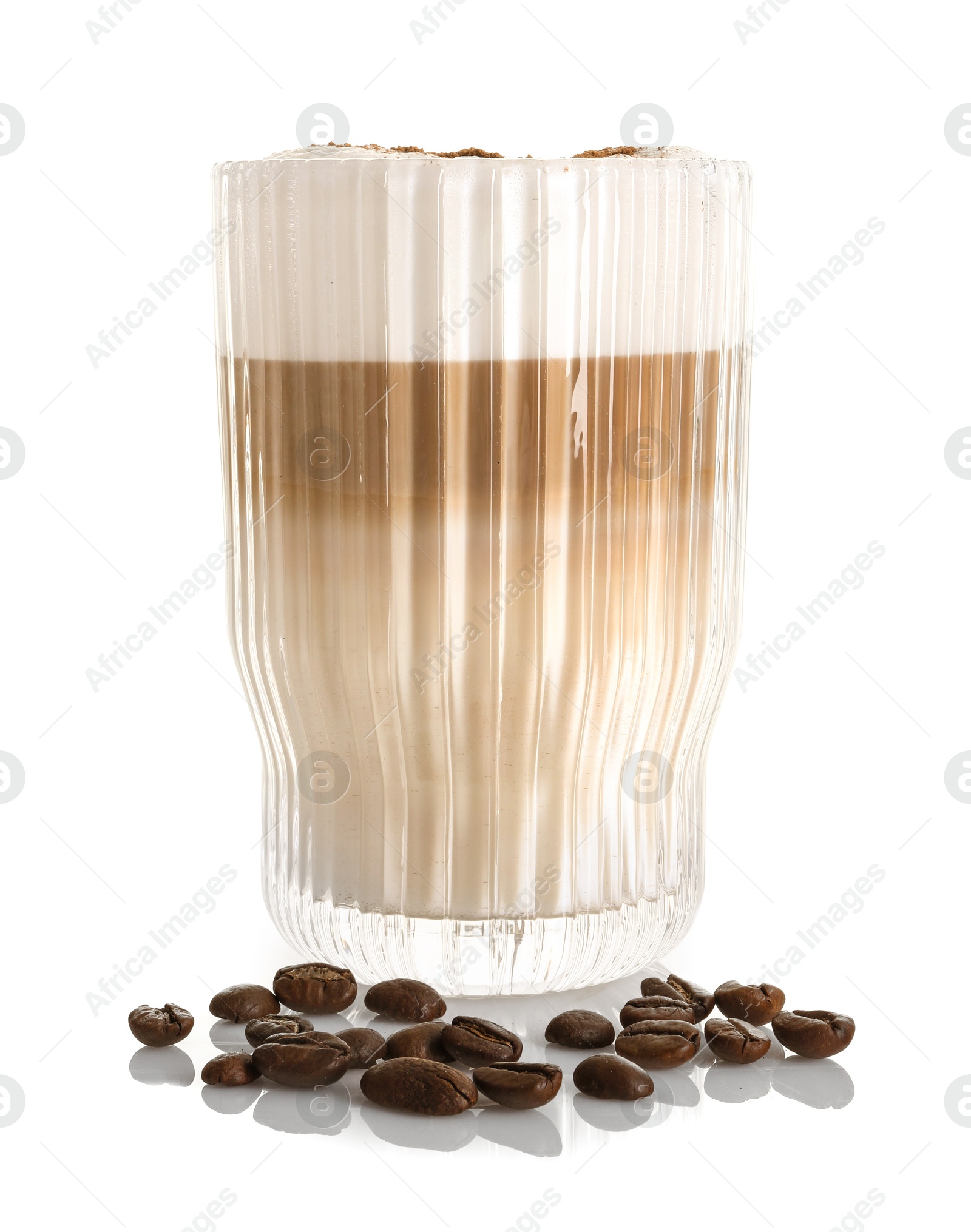 Photo of Tasty latte macchiato in glass and coffee beans isolated on white