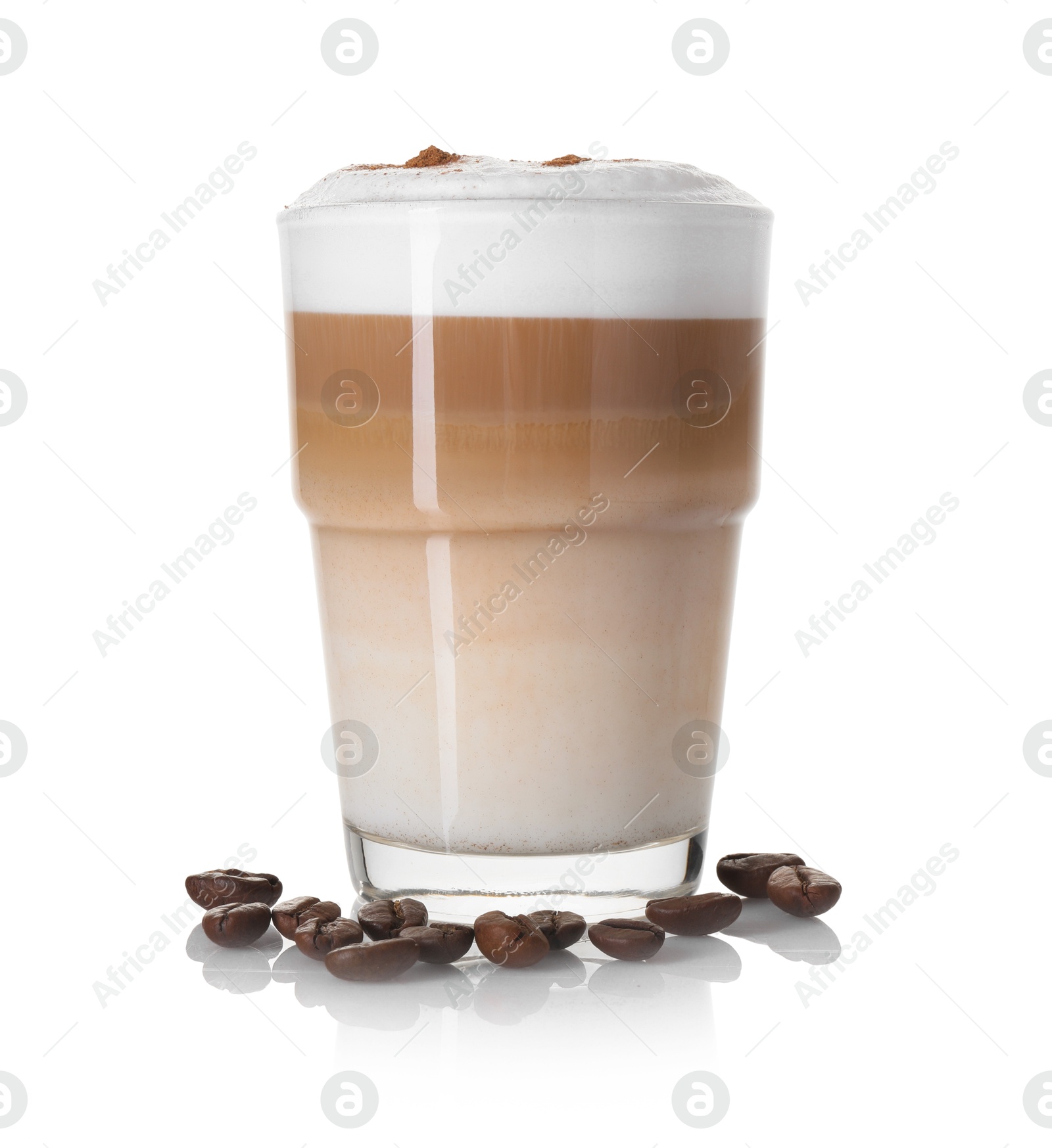 Photo of Tasty latte macchiato in glass and coffee beans isolated on white