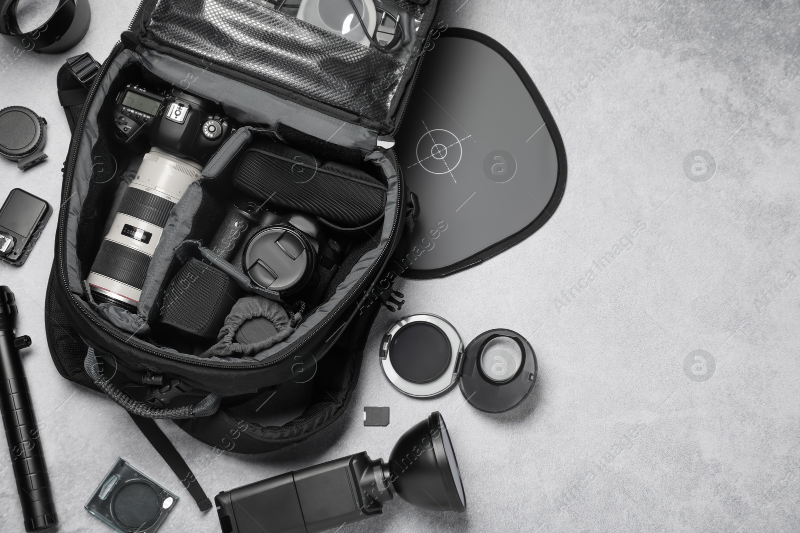 Photo of Photographer's equipment on grey background, flat lay. Space for text