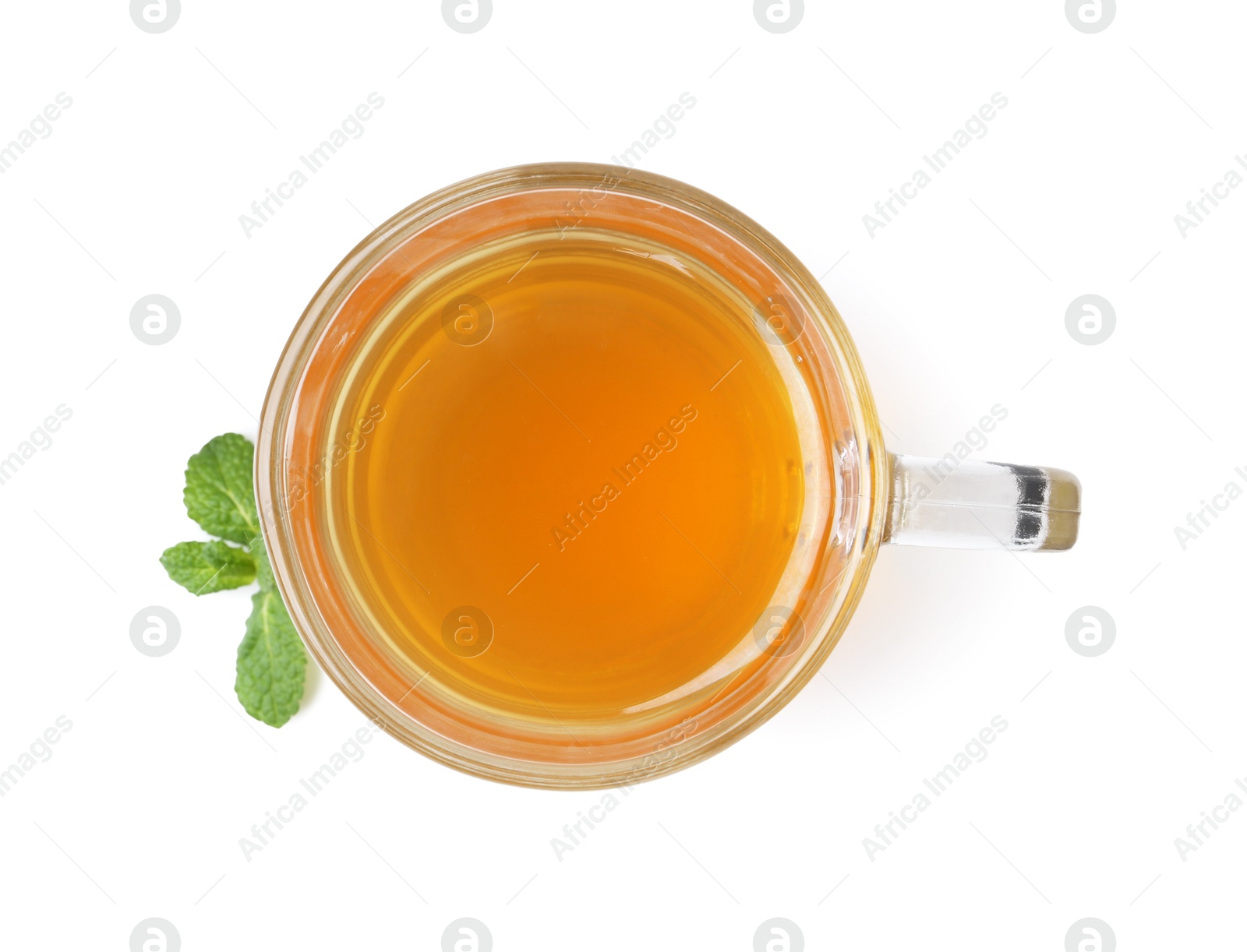 Photo of Aromatic mint tea and fresh leaves isolated on white