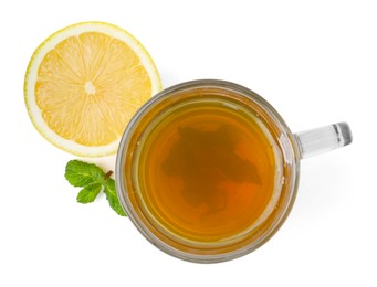 Photo of Aromatic mint tea with lemon, fresh and dried leaves isolated on white