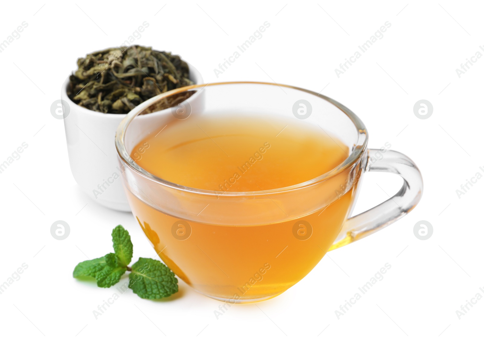 Photo of Aromatic mint tea, fresh and dried leaves isolated on white