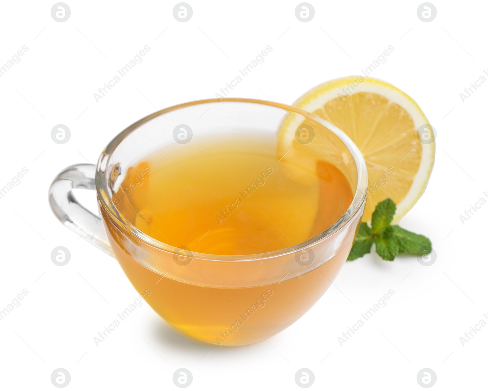 Photo of Aromatic mint tea with lemon, fresh and dried leaves isolated on white