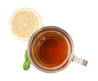 Photo of Tasty mint tea in cup, lemon and fresh leaves isolated on white, top view