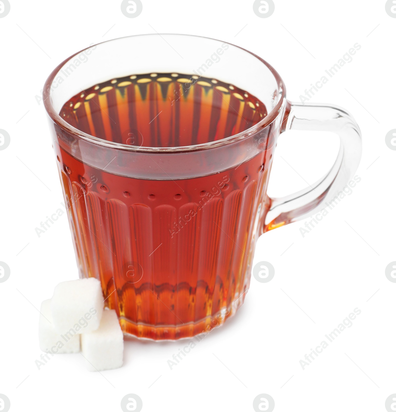 Photo of Refreshing black tea in cup and sugar cubes isolated on white