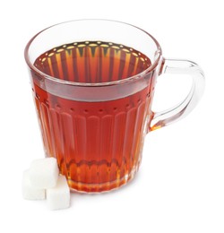 Photo of Refreshing black tea in cup and sugar cubes isolated on white