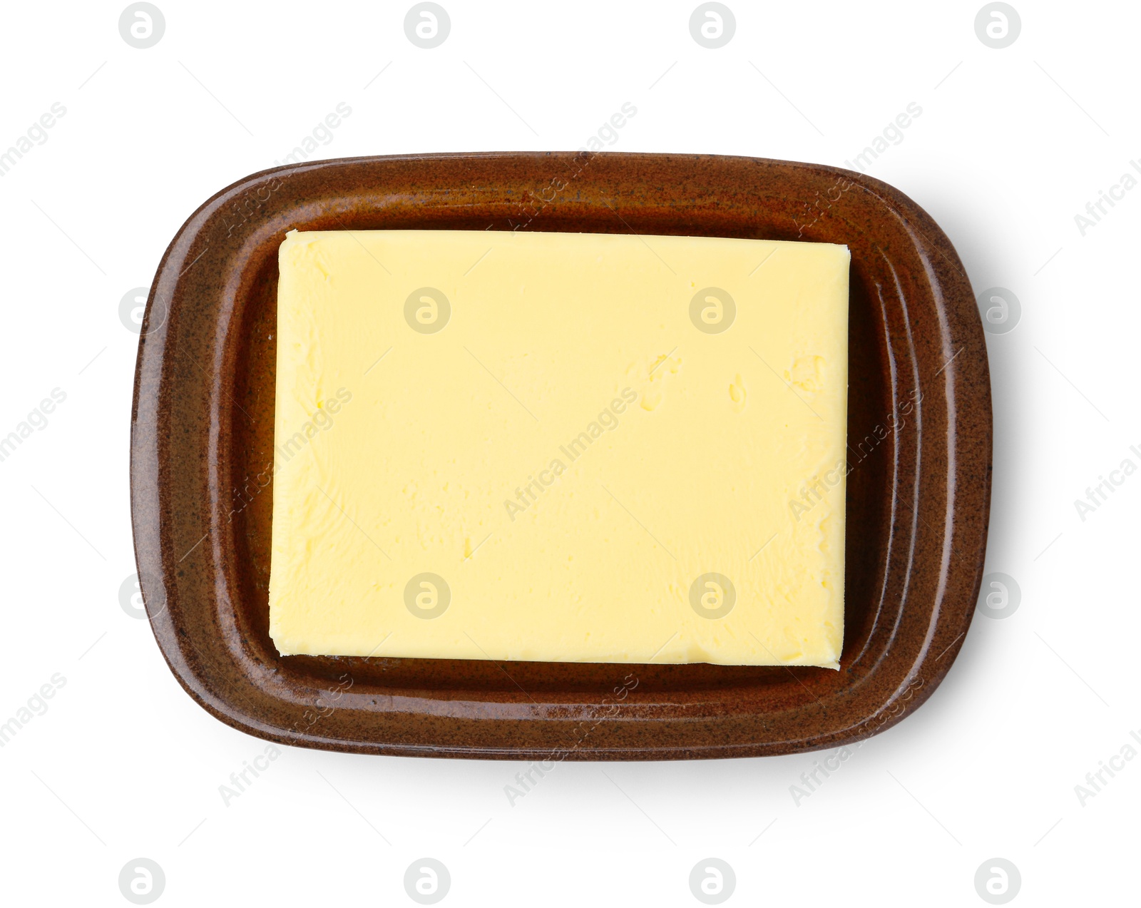 Photo of Block of tasty butter in dish isolated on white, top view