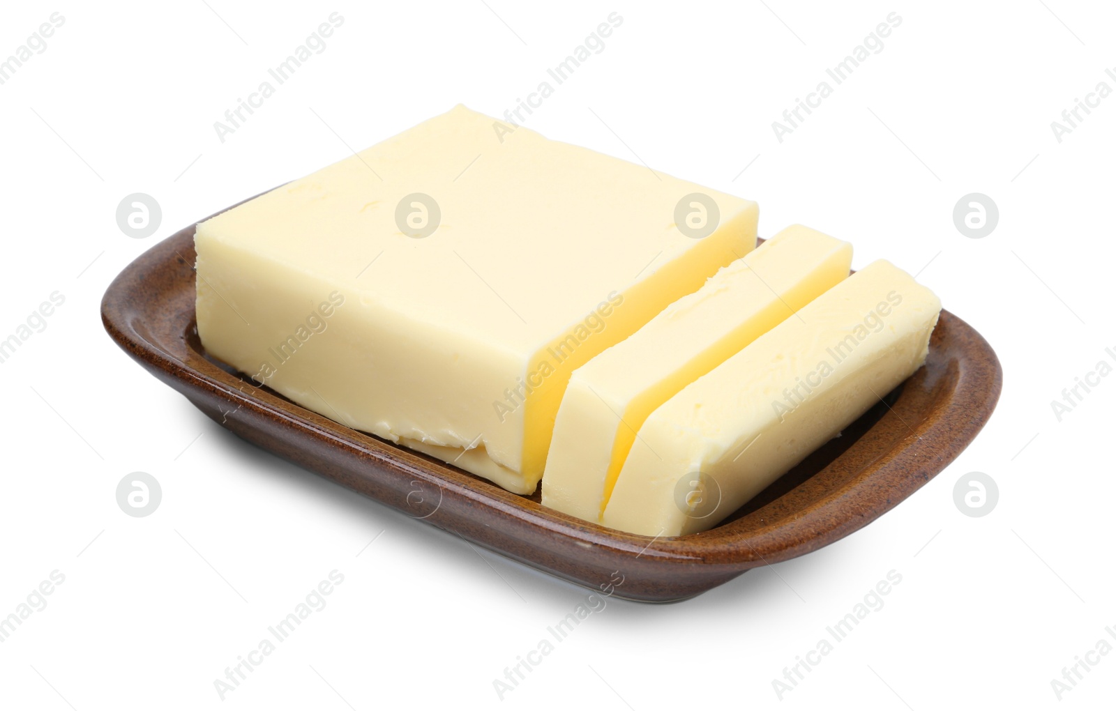 Photo of Cut tasty butter in dish isolated on white