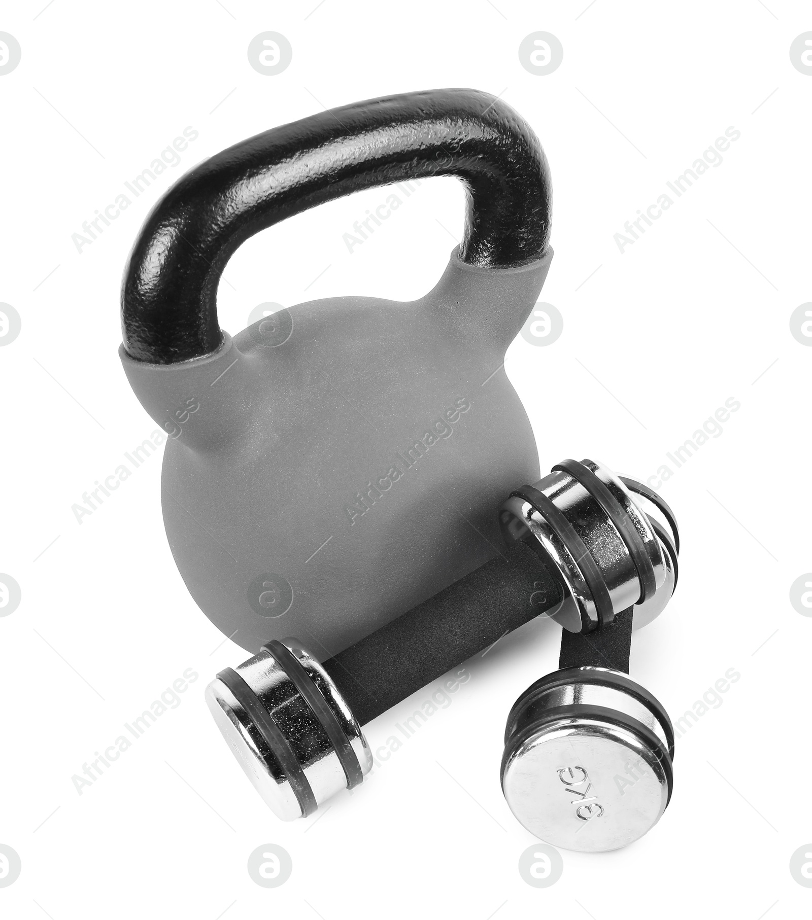 Photo of Metal kettlebell and dumbbells isolated on white