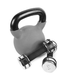 Photo of Metal kettlebell and dumbbells isolated on white