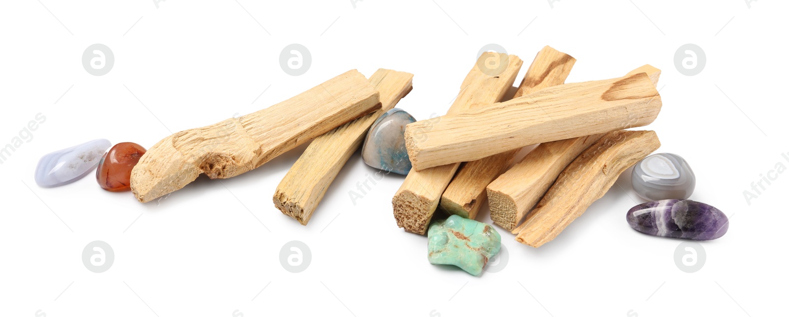 Photo of Palo santo sticks and gemstones isolated on white