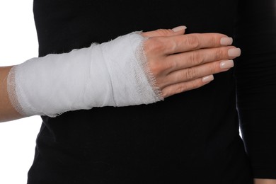 Photo of Woman with medical bandage on wrist against white background, closeup