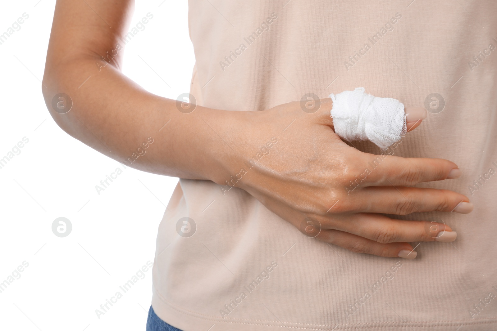 Photo of Woman with medical bandage on finger against white background, closeup