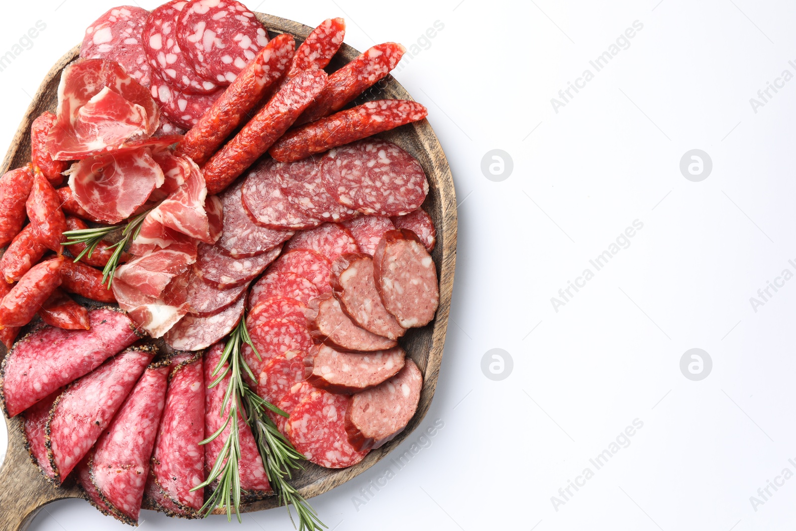 Photo of Different smoked sausages slices isolated on white, top view