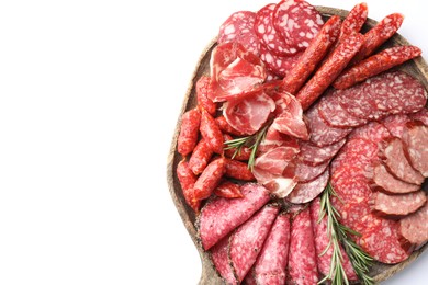 Photo of Different smoked sausages slices isolated on white, top view