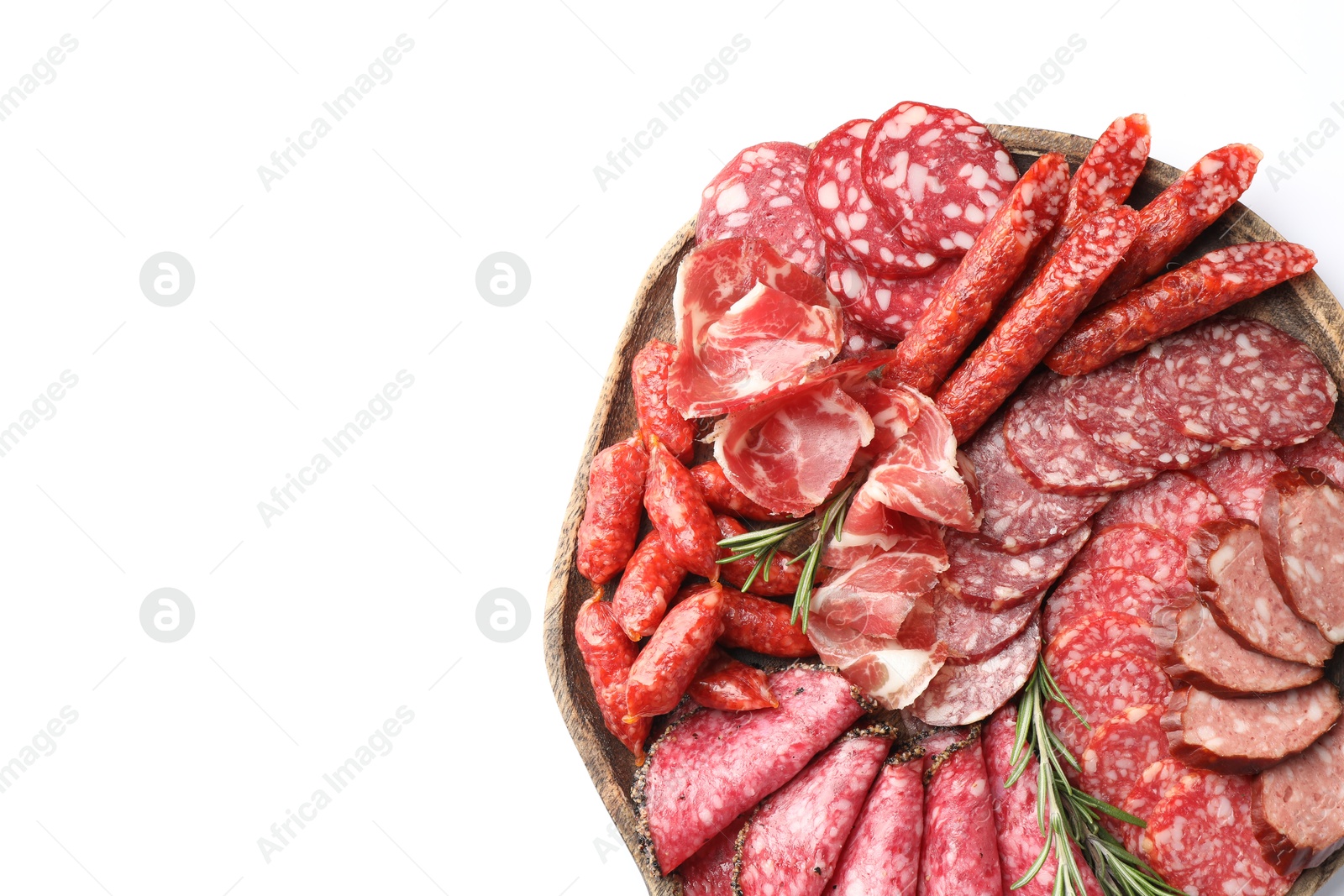 Photo of Different smoked sausages slices isolated on white, top view