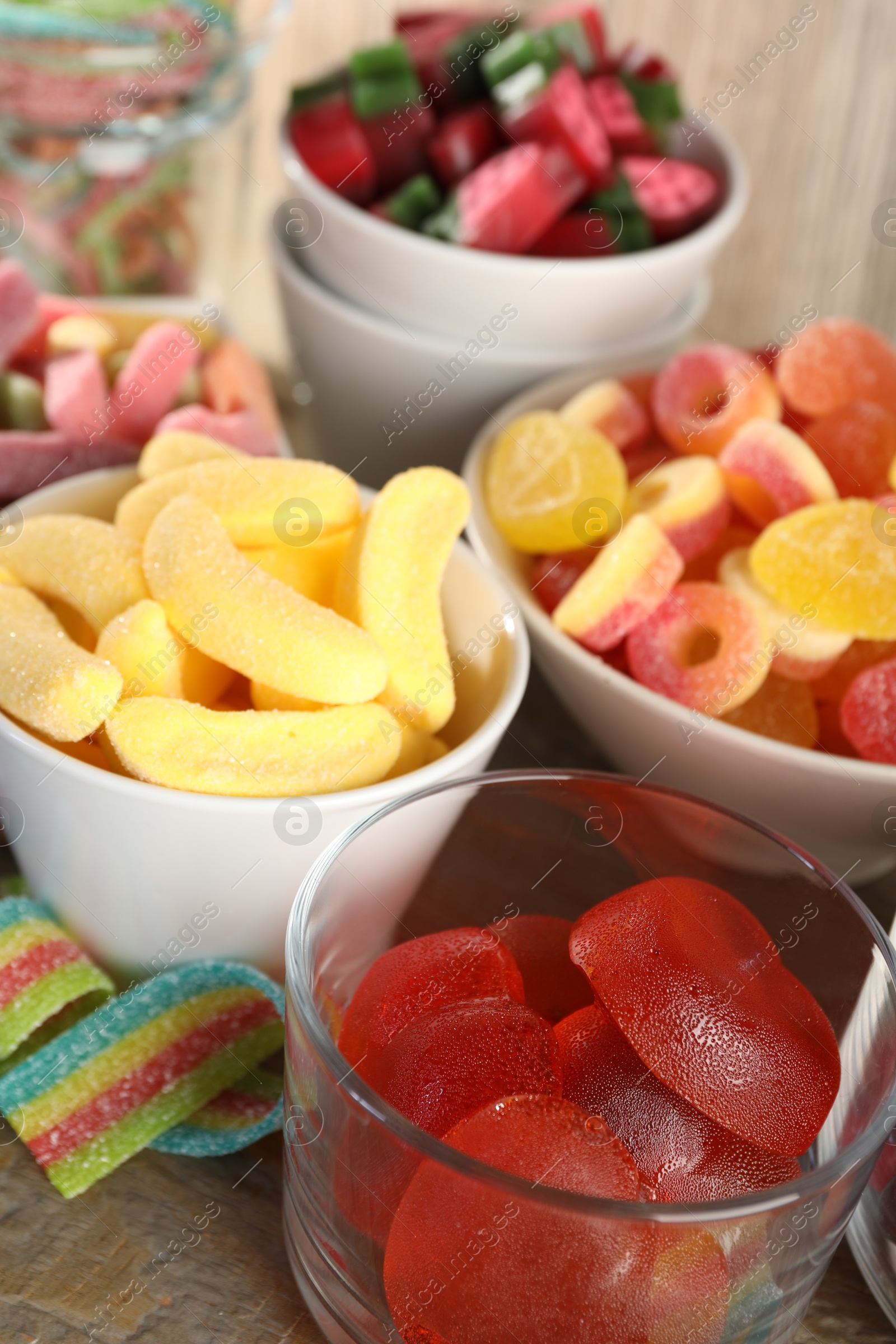 Photo of Candy bar. Many different sweets on wooden table, closeup