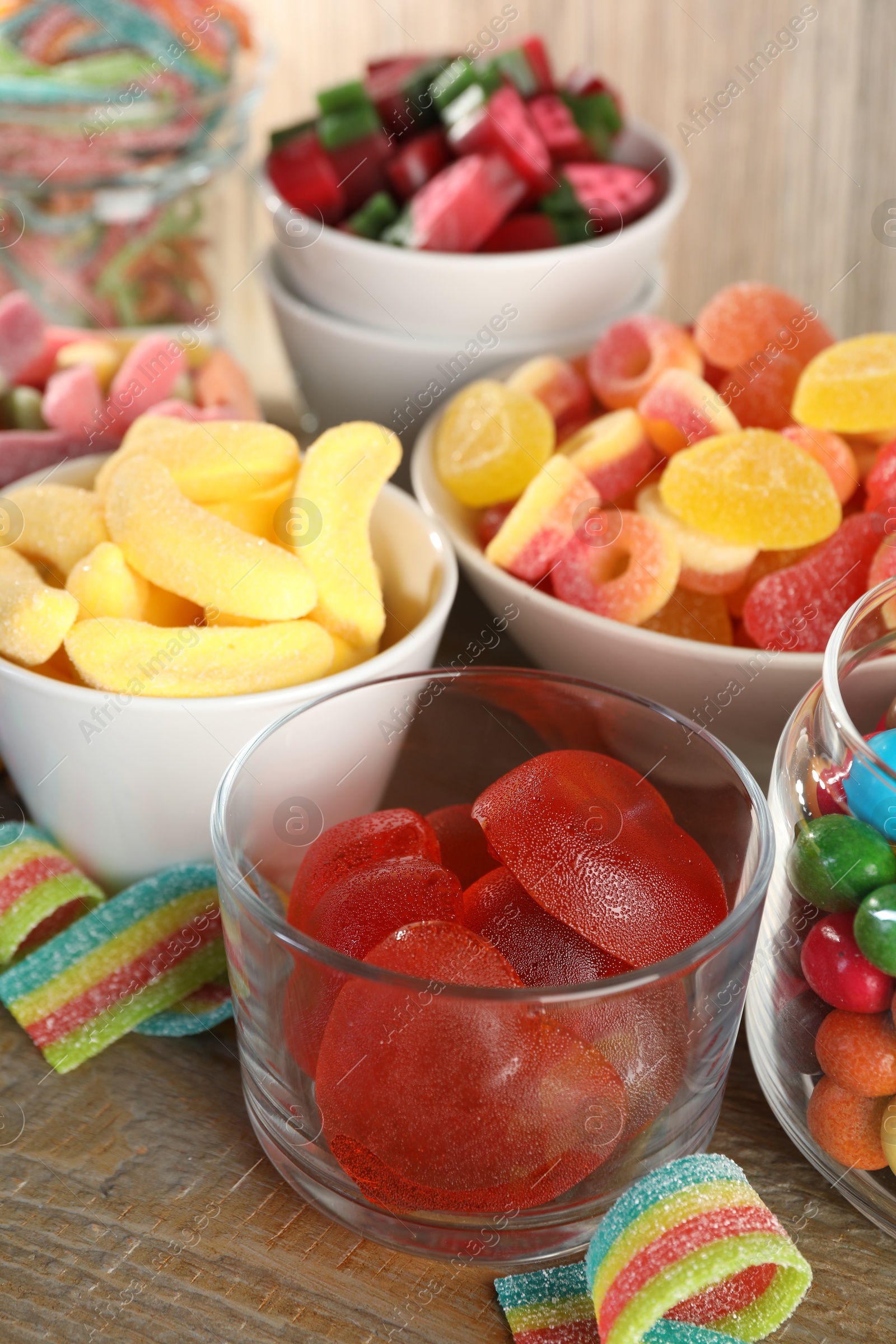 Photo of Candy bar. Many different sweets on wooden table, closeup