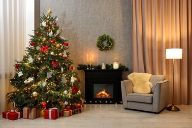 Photo of Cozy room with Christmas tree, fireplace and armchair. Interior design for holiday