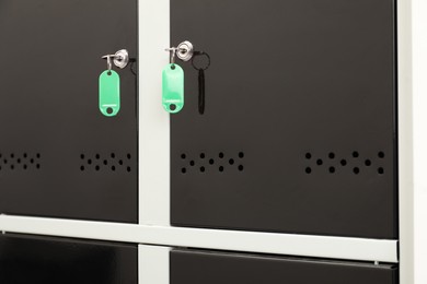 Photo of Modern lockers with bright keys, closeup view