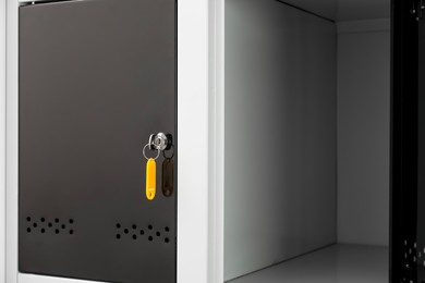 Photo of Modern lockers with bright key, closeup view