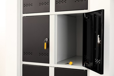 Photo of Modern lockers with bright keys indoors, closeup